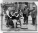 1921 police raid pours confiscated liquor into sewer during alcohol Prohibition