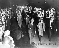 Historic 1920s photo of police officers posing with confiscated alcohol during Prohibition